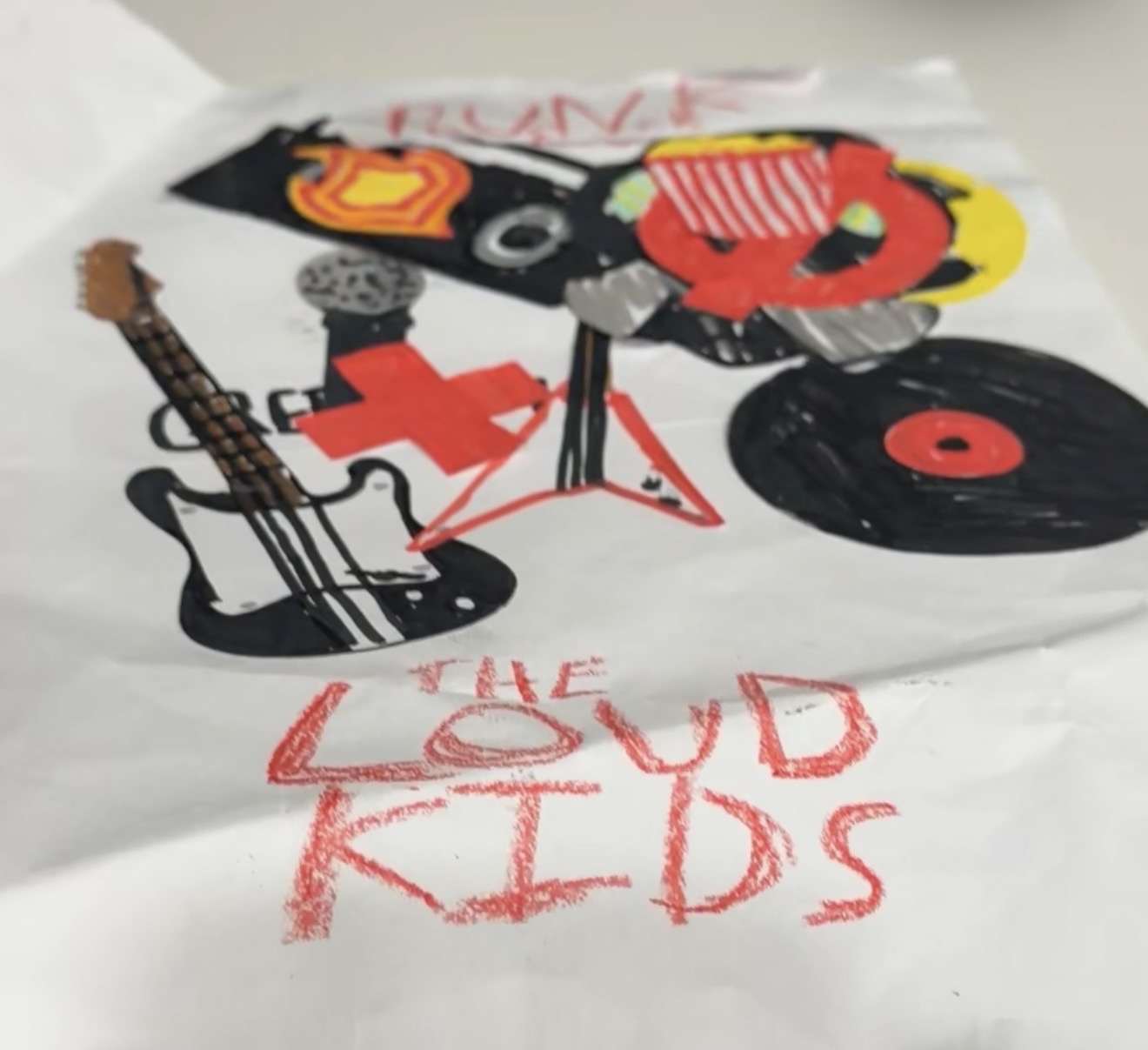 Original LOUD KIDS artwork featuring a guitar, microphone, drums and a vinyl record in black, red and yellow